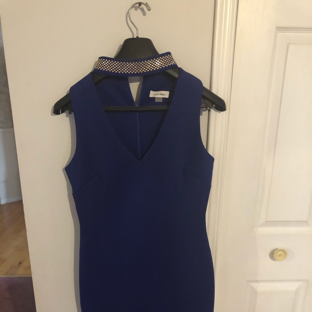 Blue  dress with beading around necklace